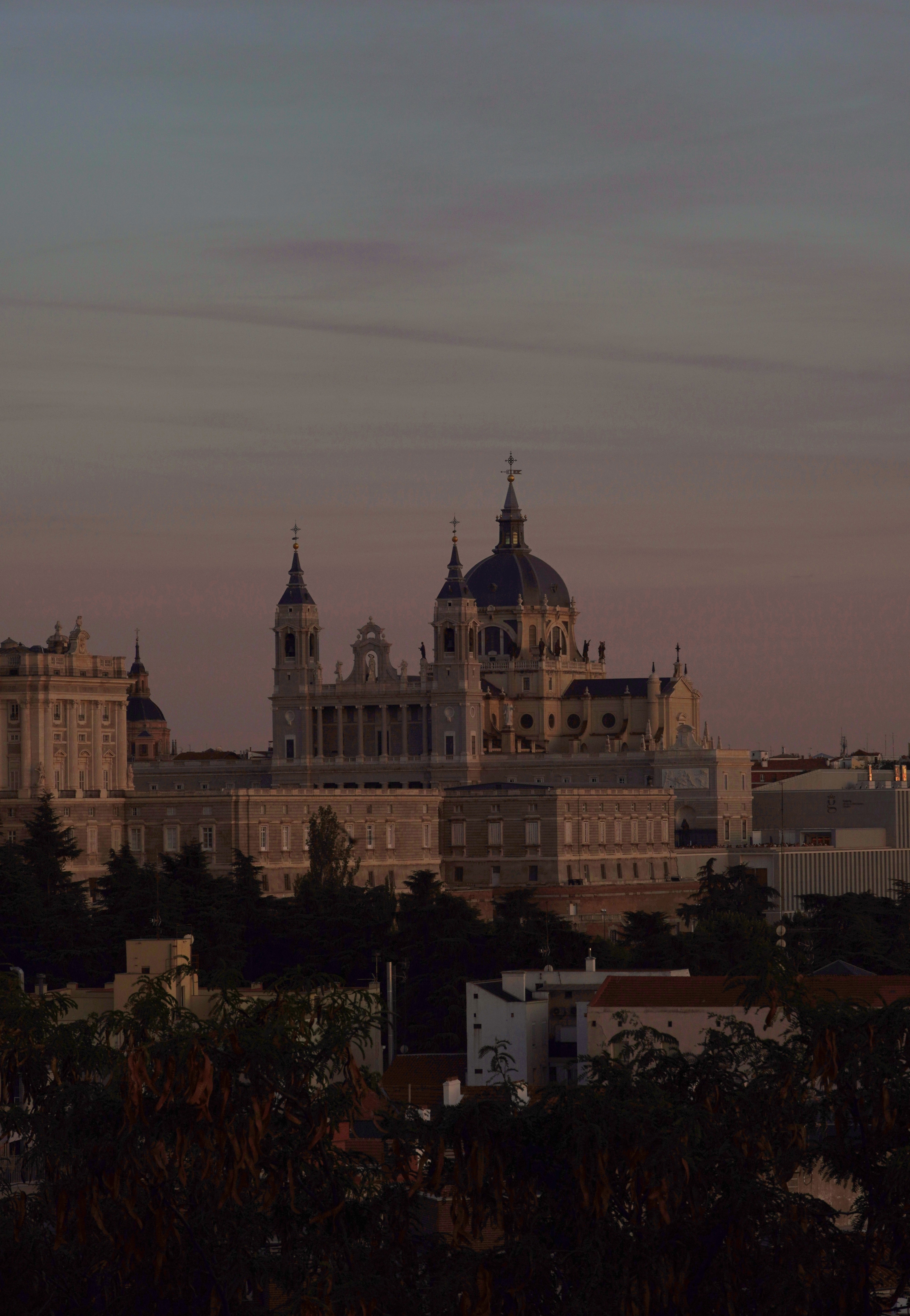 Madrid cathedral and palace silhouetted against dramatic twilight sky