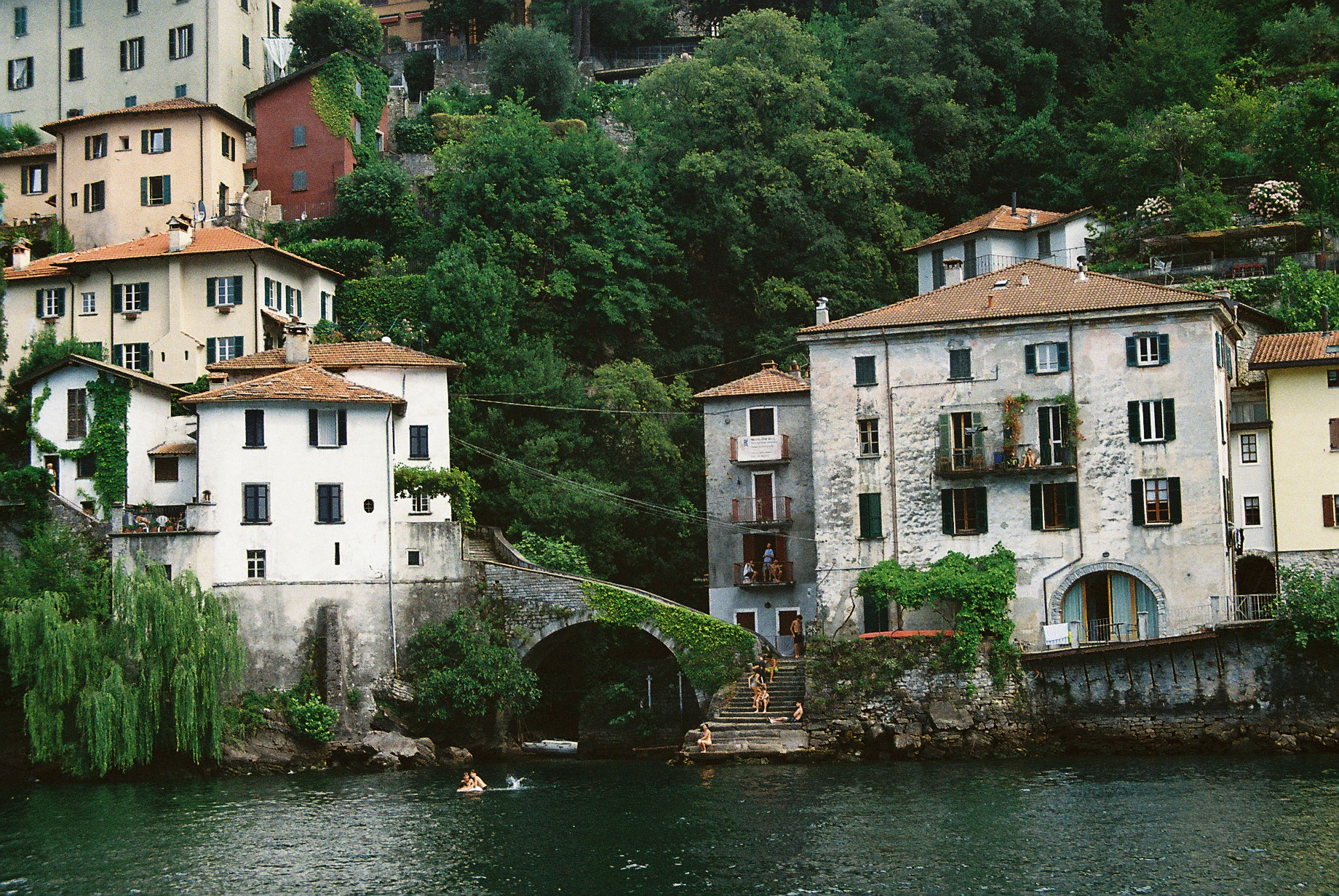 European lakeside village with stone bridge
